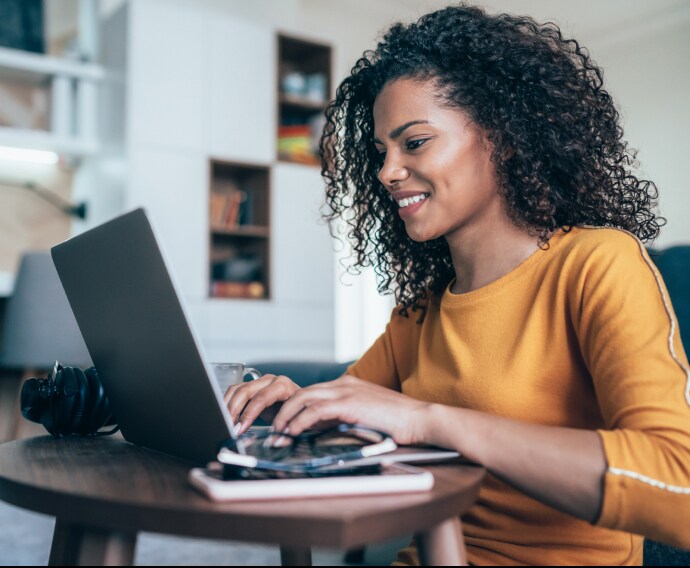 Woman home office with laptop.